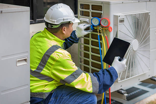 Professional Emergency Ac Repair technician working in Athens, IL